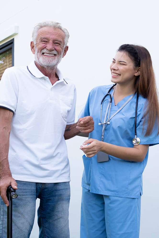 Nurse Comforting Elderly Woman at Nursing Home Colleyville
