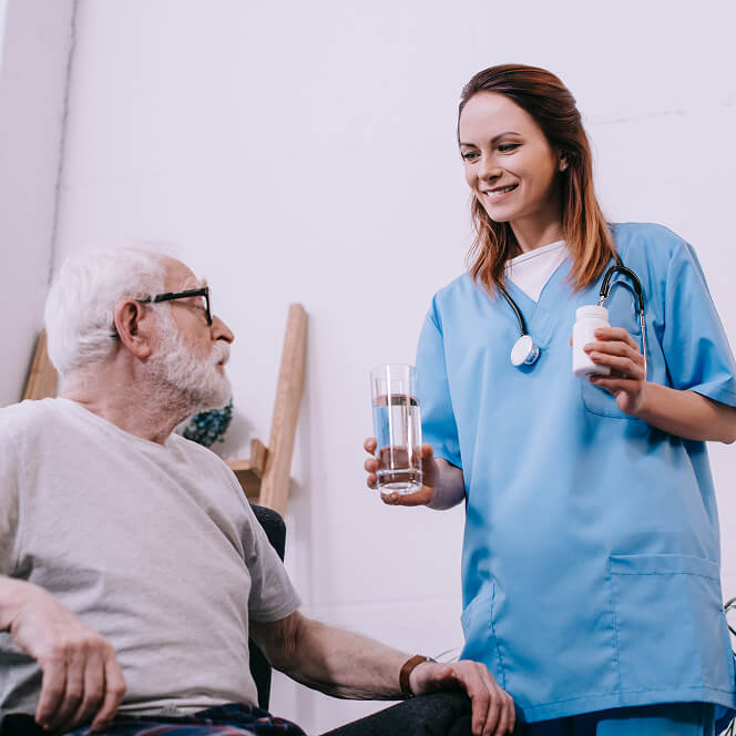 Caregiver Comforting Resident at Memory Care Facility